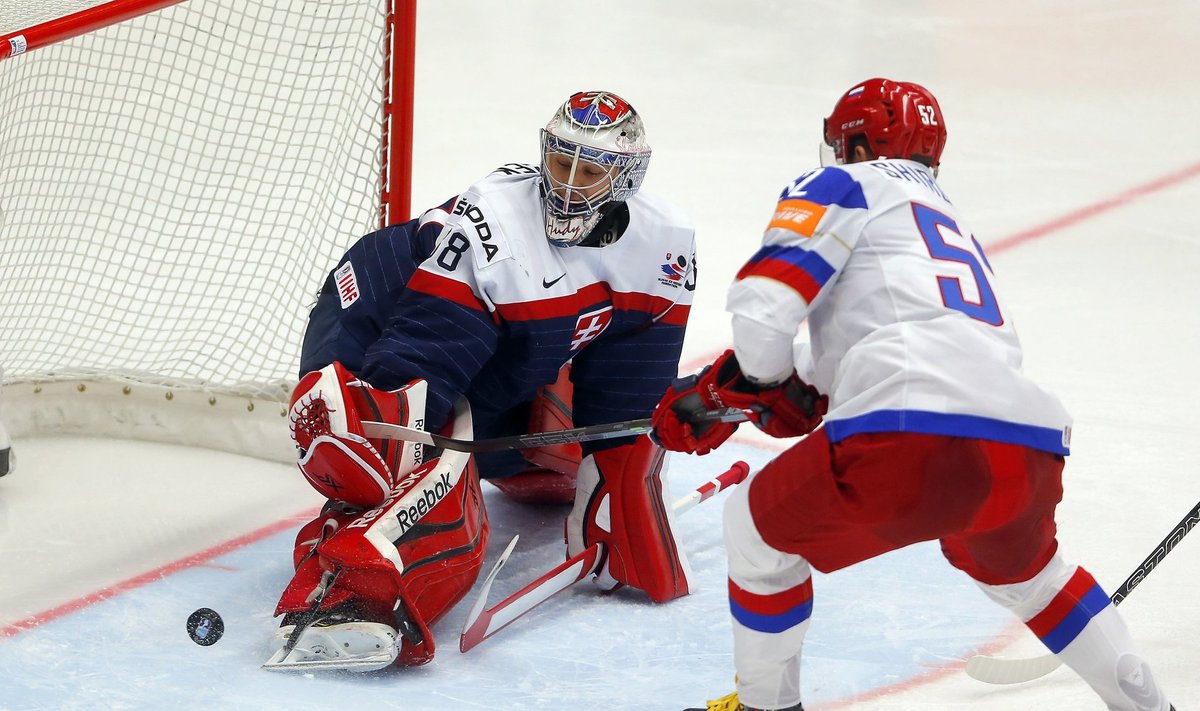 Slovakia's goaltender Hudacek defends against Russia's Shirokov during their Ice Hockey World Championship game at the CEZ arena in Ostrava