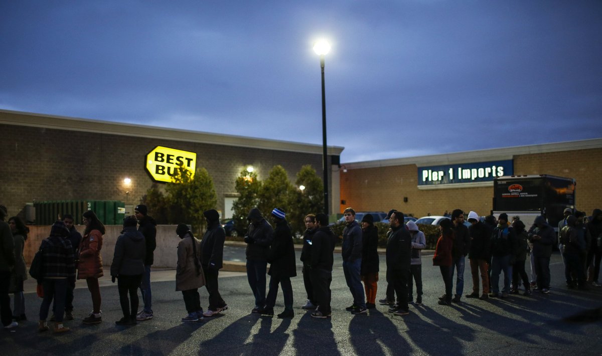 Shoppers line up outside Best Buy before the store opens in Newport