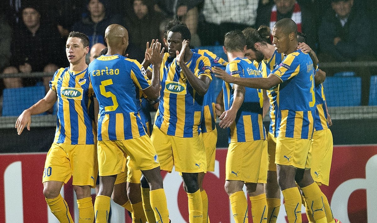 APOEL Nicosia of Cyprus' players celebrates a goal by Vinicius during their Champions League play-off match against Aab Aalborg of Denmark at the Nordjyske Arena in Aalborg