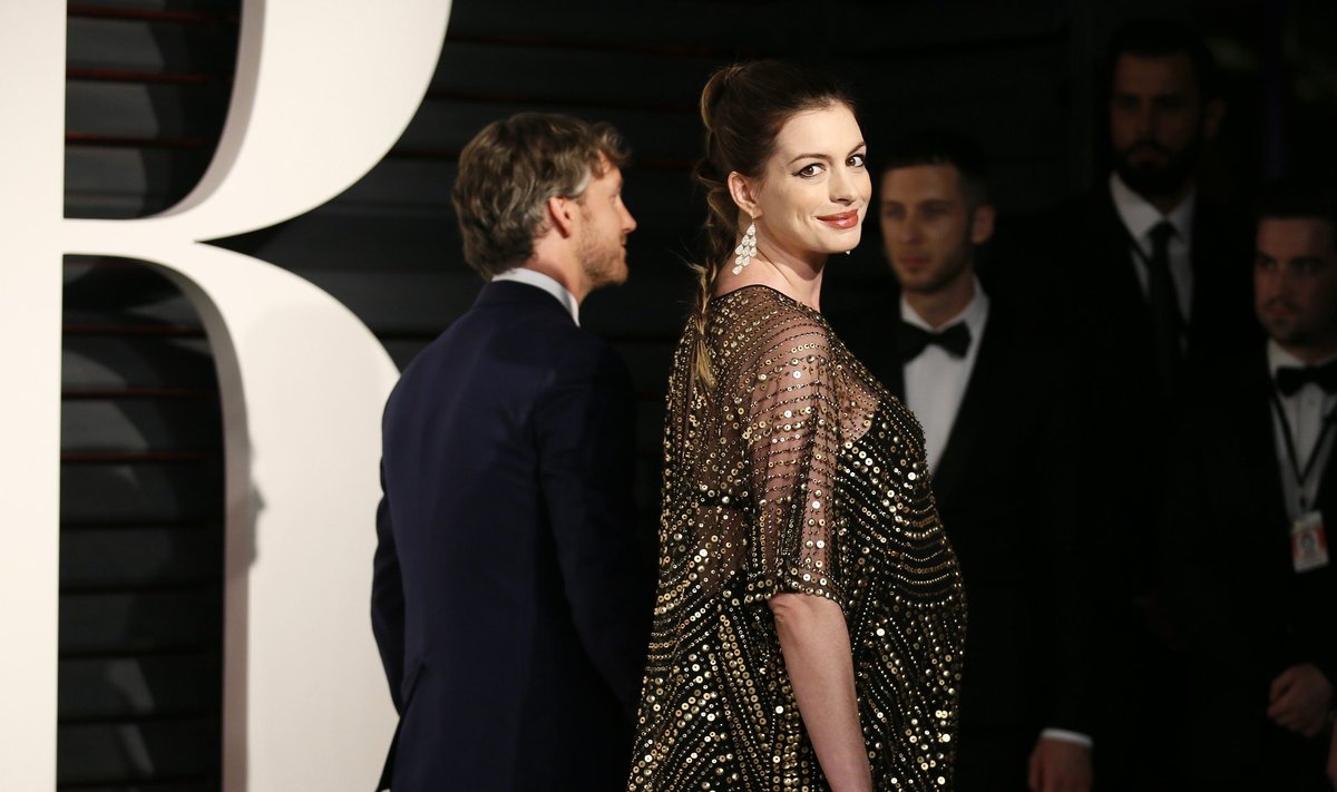 Actress Anne Hathaway and husband, Adam Shulman, arrive at the Vanity Fair Oscar Party in Beverly Hills