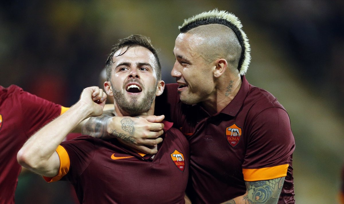 AS Roma's Pjanic celebrates his goal against Parma during their Italian Serie A soccer match at the Tardini stadium in Parma