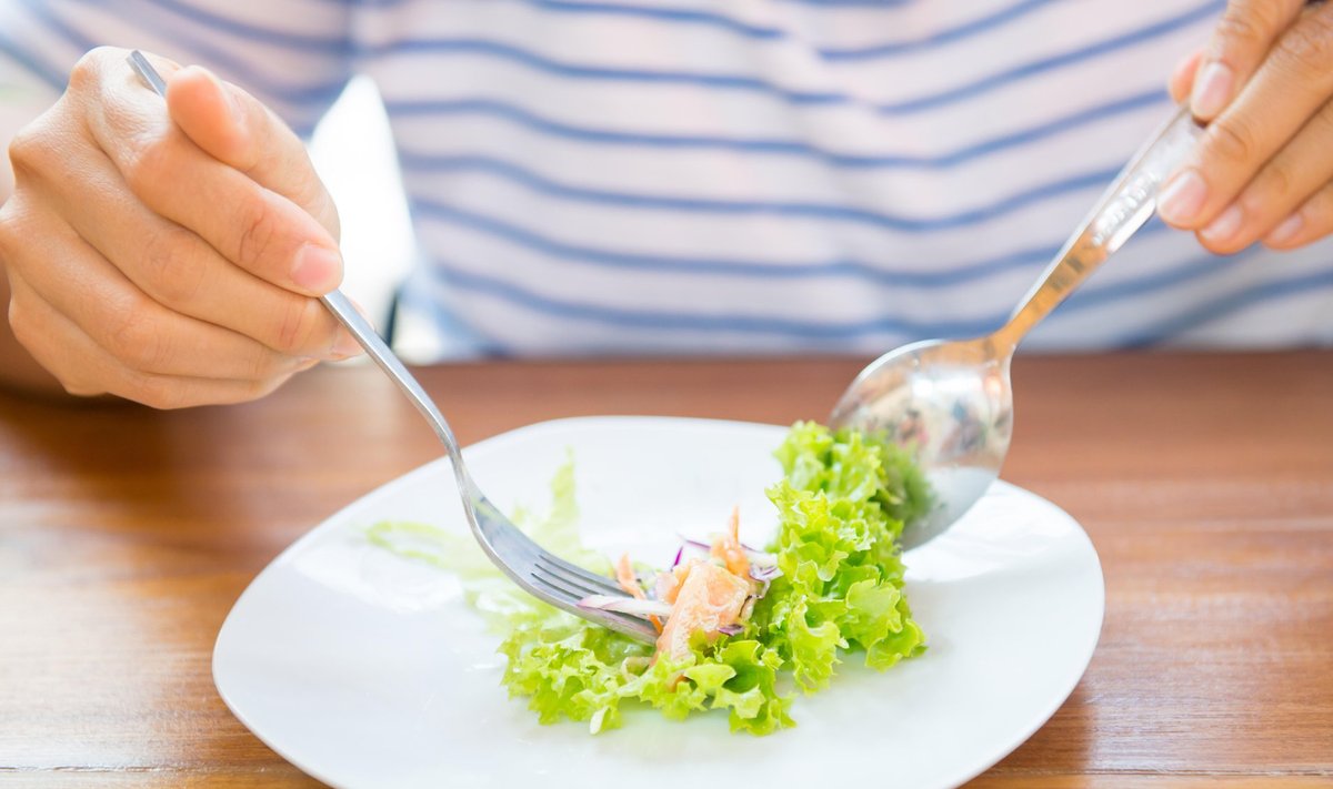 women eating fresh healthy salad