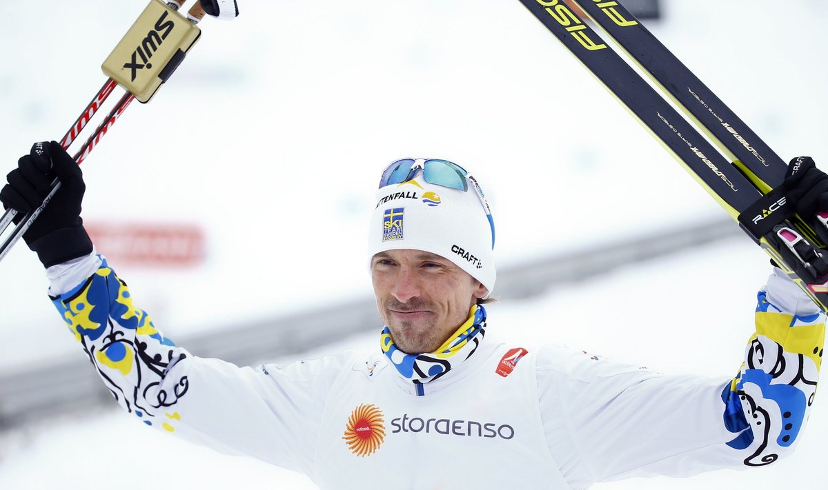 Sweden's Johan Olsson celebrates winning the men's 15 km free individual race at the Nordic World Ski Championships in Falun