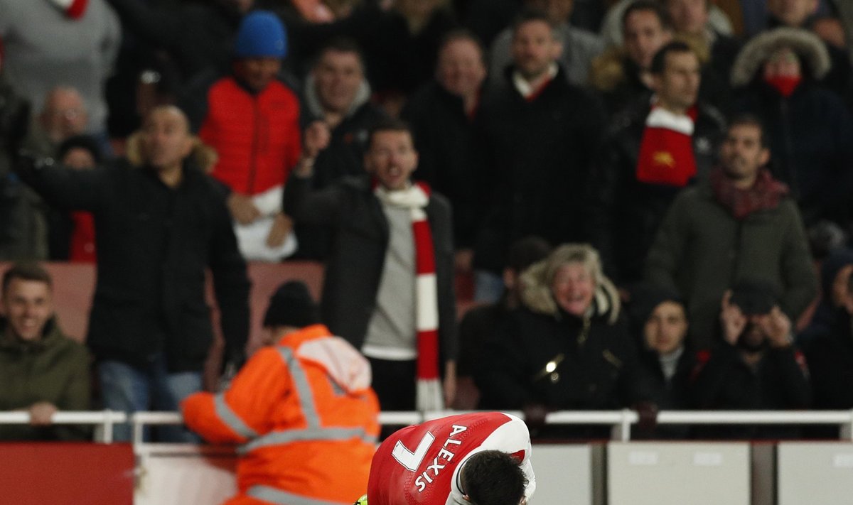 Arsenal's Alexis Sanchez lies injured