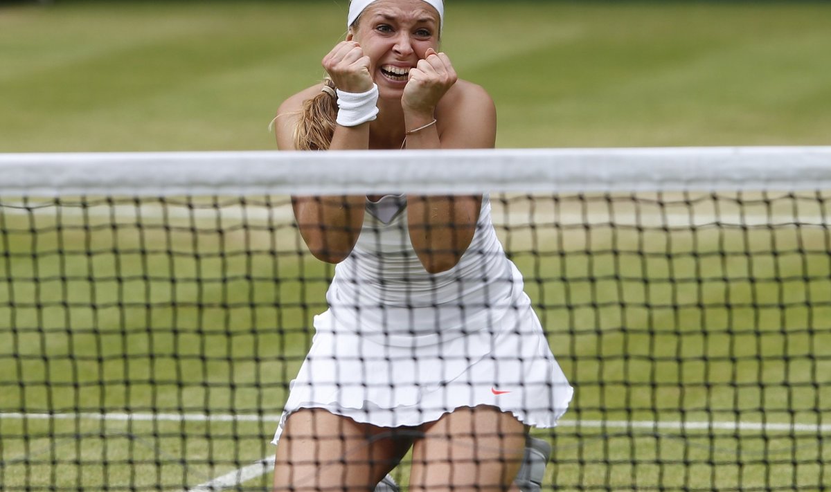 Sabine Lisicki of Germany celebrates after defeating Serena Williams of the U.S. during their women's singles tennis match at the Wimbledon Tennis Championships, in London