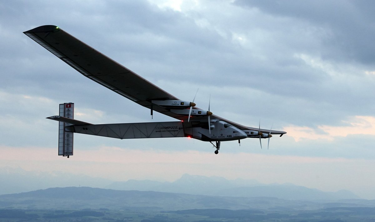 German test pilot Markus Scherdel steers the solar-powered Solar Impulse 2 aircraft for its maiden flight at its base in Payerne