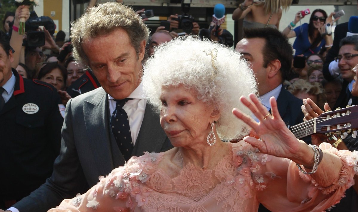 File photo of Spain's Duchess of Alba Cayetana Fitz-James Stuart y Silva dancing flamenco beside her husband outside Las Duenas Palace after their wedding in Seville