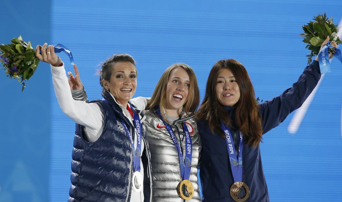Medallists celebrate during the victory ceremony for the women's freestyle skiing halfpipe event at the 2014 Sochi Winter Olympics