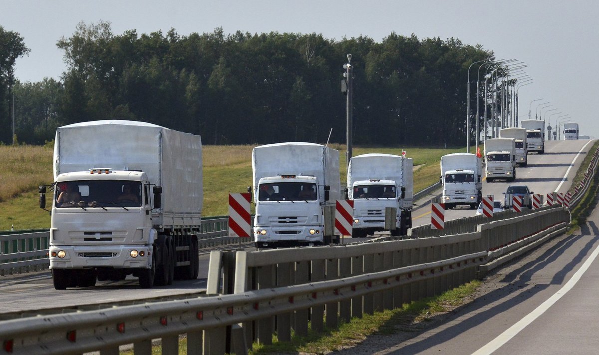 A Russian convoy of trucks carrying humanitarian aid for Ukraine drives along a road near the city of Yelets