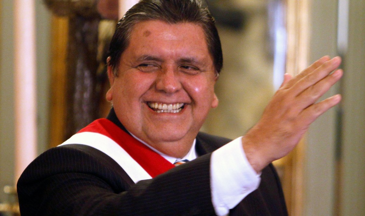 FILE PHOTO: Garcia waves to the crowd during his new cabinet swearing-in ceremony at the Government Palace in Lima