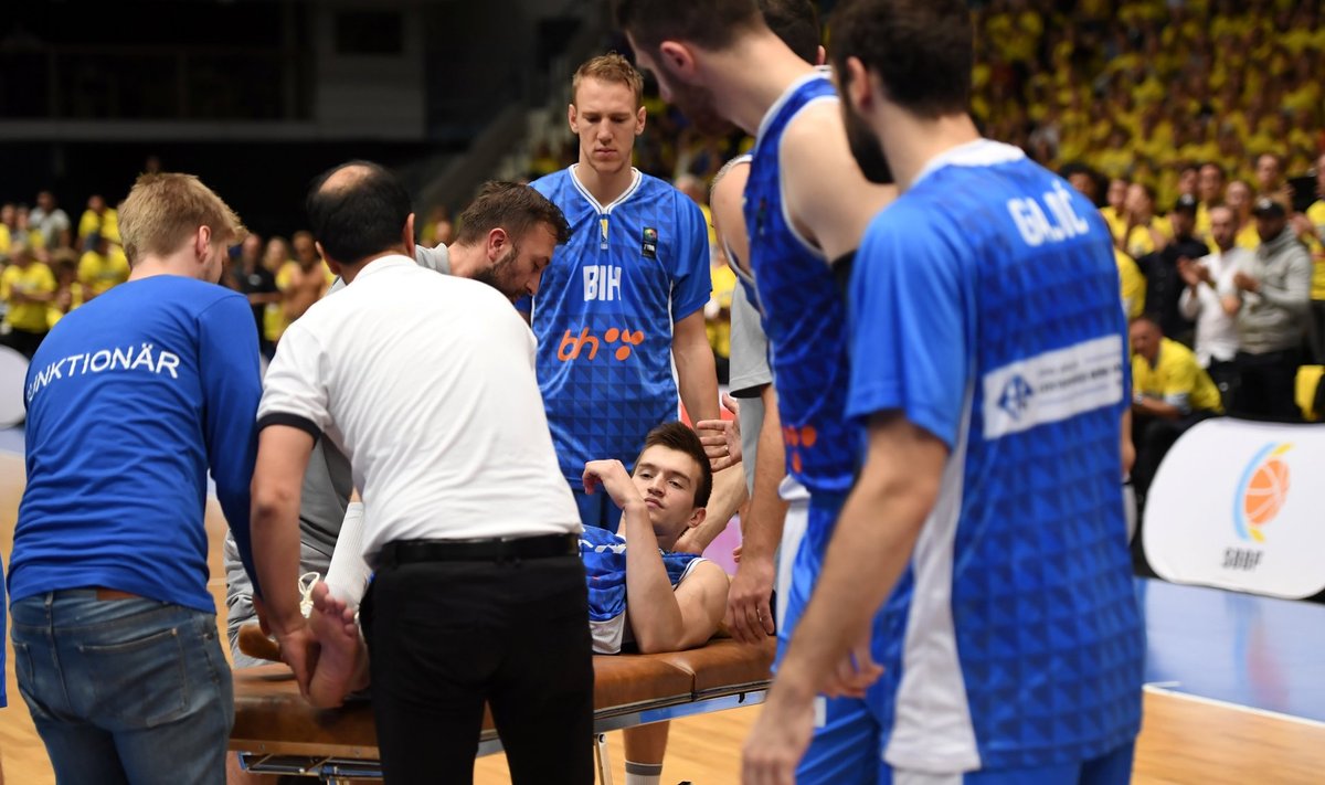 Bosnia's Nedim Buza is carried off after being injured during European Championship basketball qualification match group C between Sweden and Bosnia and Herzegovina at Hovet arena in Stockholm