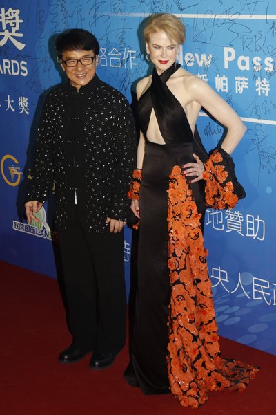 Australian actress Nicole Kidman and Hong Kong actor Jackie Chan pose on the red carpet at the Huading Awards ceremony in Macau