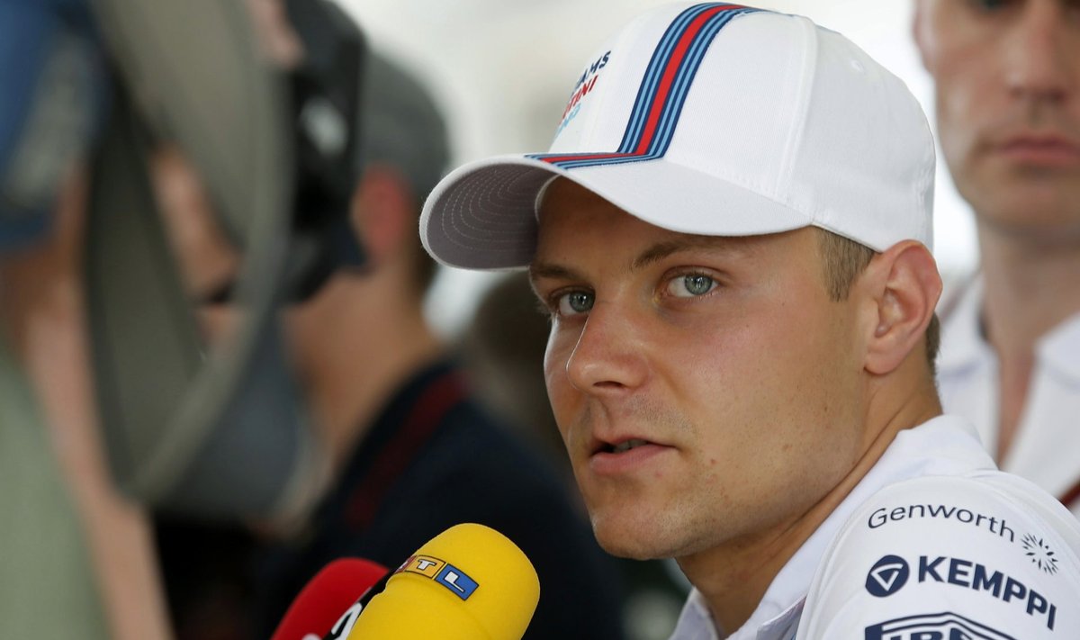 Williams Formula One driver Bottas is interviewed by journalists ahead of the Malaysian F1 Grand Prix at Sepang International Circuit outside Kuala Lumpur