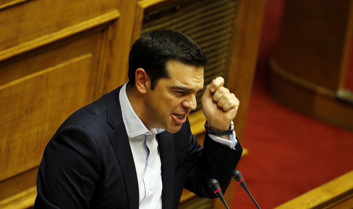 Greek Prime Minister Alexis Tsiprasis delivers a speech during a late night parliamentary voting session in Athens