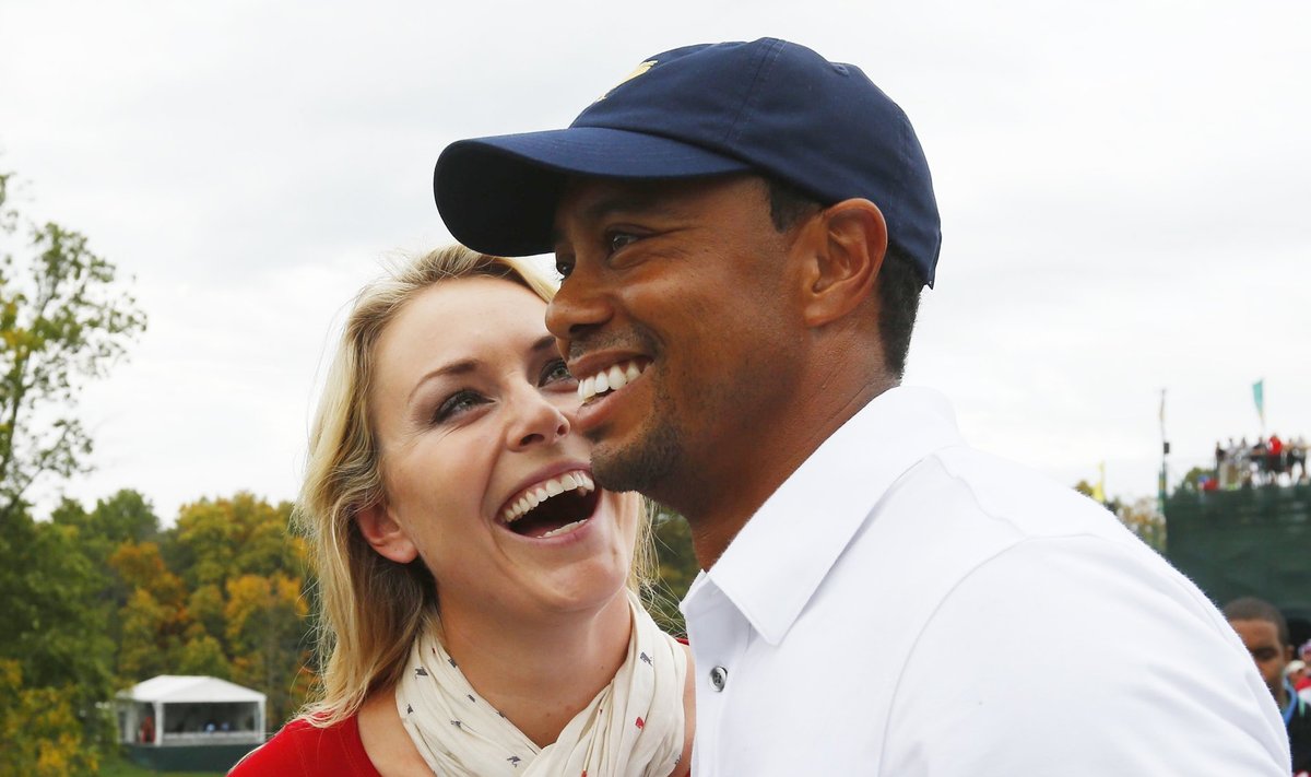 U.S team member Woods celebrates with girlfriend Vonn after Woods won his match and the U.S. won the Presidents Cup on the18th hole in the 2013 Presidents Cup golf tournament at Muirfield Village Golf Club in Dublin