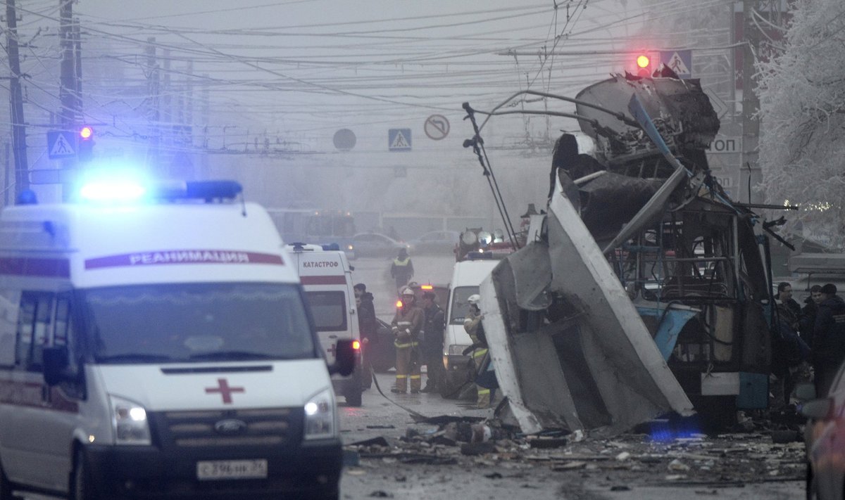 Members of the emergency services work at the site of a bomb blast on a trolleybus in Volgograd
