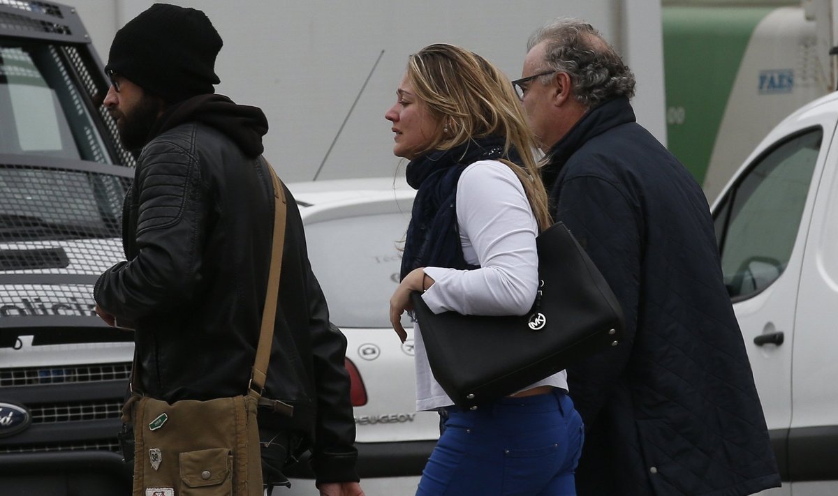 People believed to be family members of those killed in Germanwings plane crash arrive at Barcelona's El Prat airport