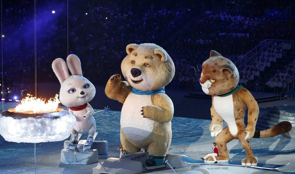 Olympic Games mascots extinguish the Olympic flame in a small cauldron in the stadium, during the closing ceremony for the 2014 Sochi Winter Olympics