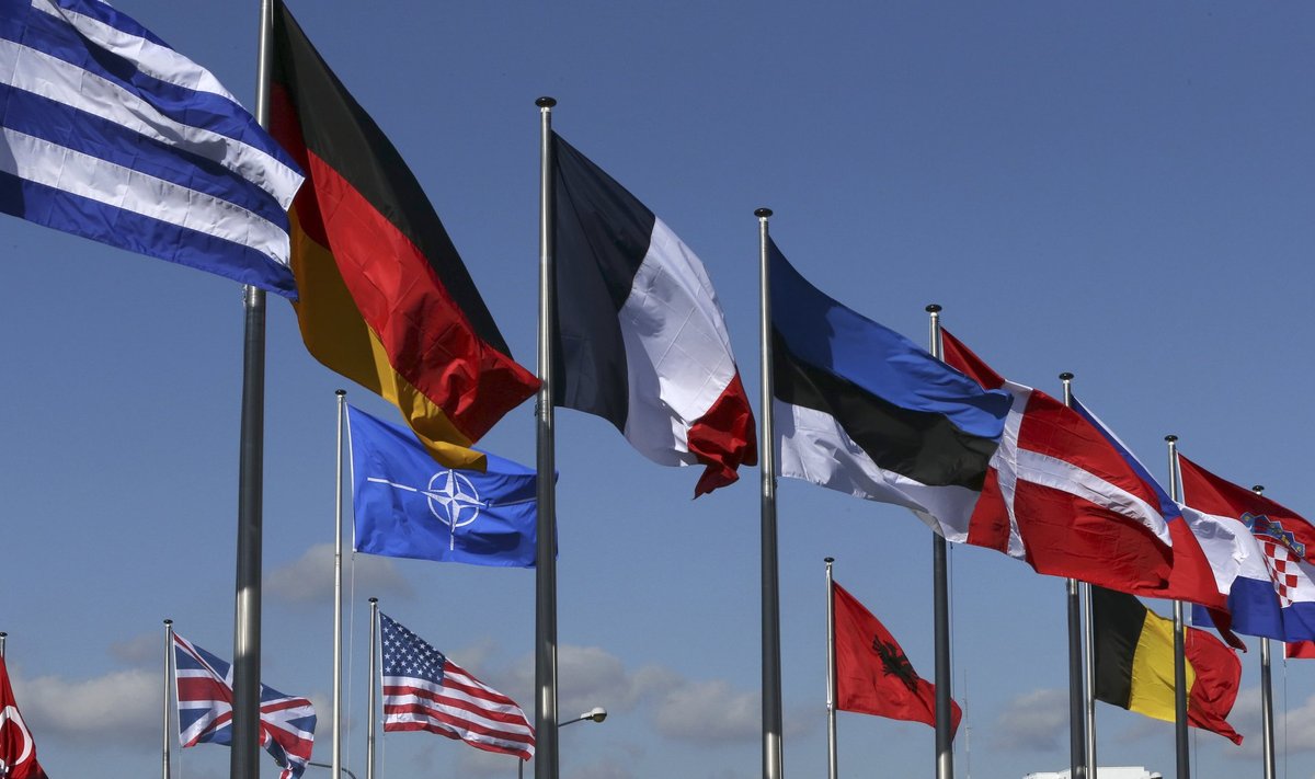 Flags fly at the Alliance headquarters in Brussels during a NATO ambassadors meeting on the situation in Ukraine and Crimea region
