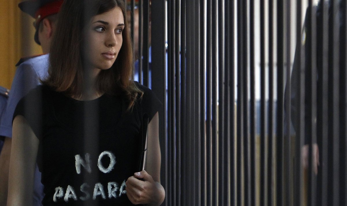 A member of the female punk band "Pussy Riot", Tolokonnikova, is escorted before a court hearing to appeal for parole at the Supreme Court of Mordovia in Saransk