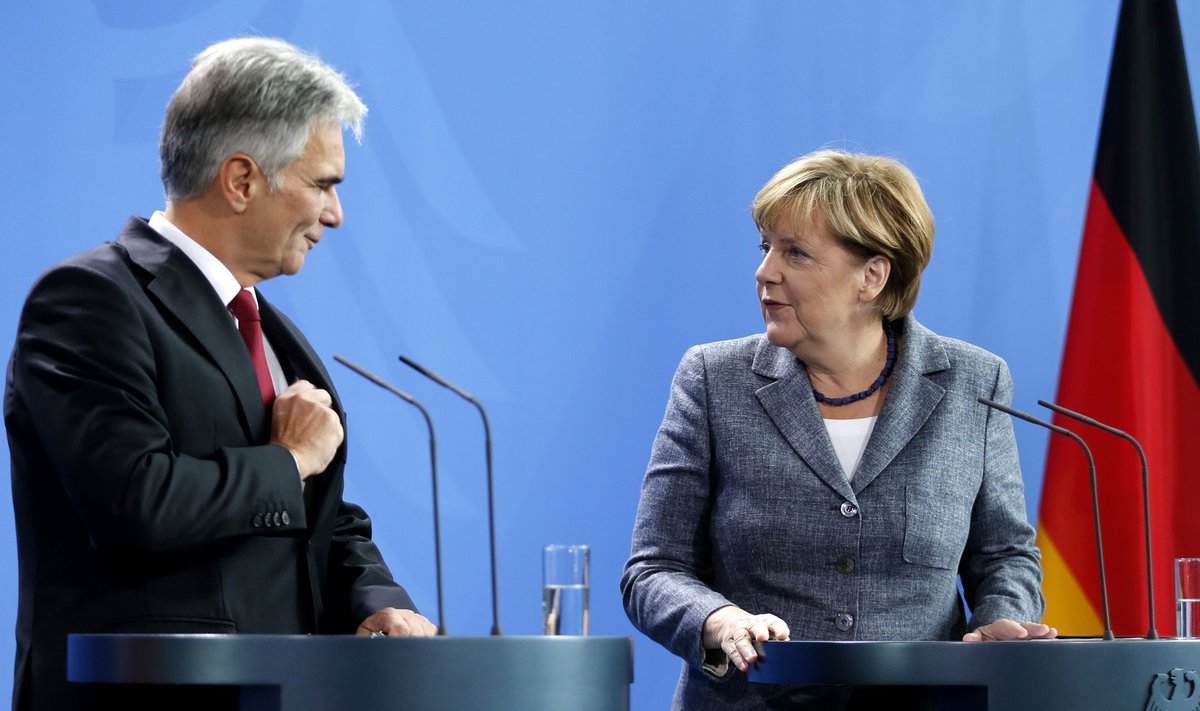 German Chancellor Merkel and Austrian Chancellor Faymann address a news conference at the chancellery in Berlin