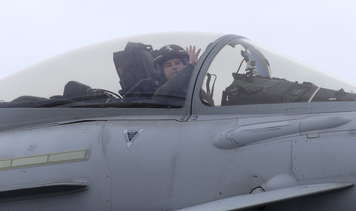 An Italian Air Force pilot reacts as his Eurofighter Typhoon lands after a NATO air policing mission at Zokniai air base near Siauliai