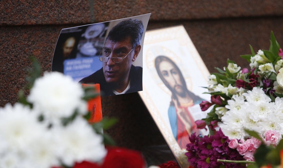 A photo, an icon and flowers are placed at the site where Boris Nemtsov was shot dead, near the Kremlin in central Moscow