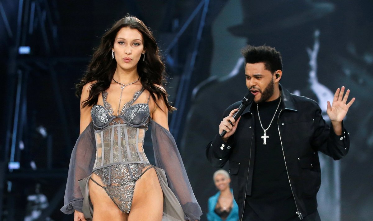 Model Bella Hadid presents a creation as singer The Weeknd performs during the 2016 Victoria's Secret Fashion Show at the Grand Palais in Paris