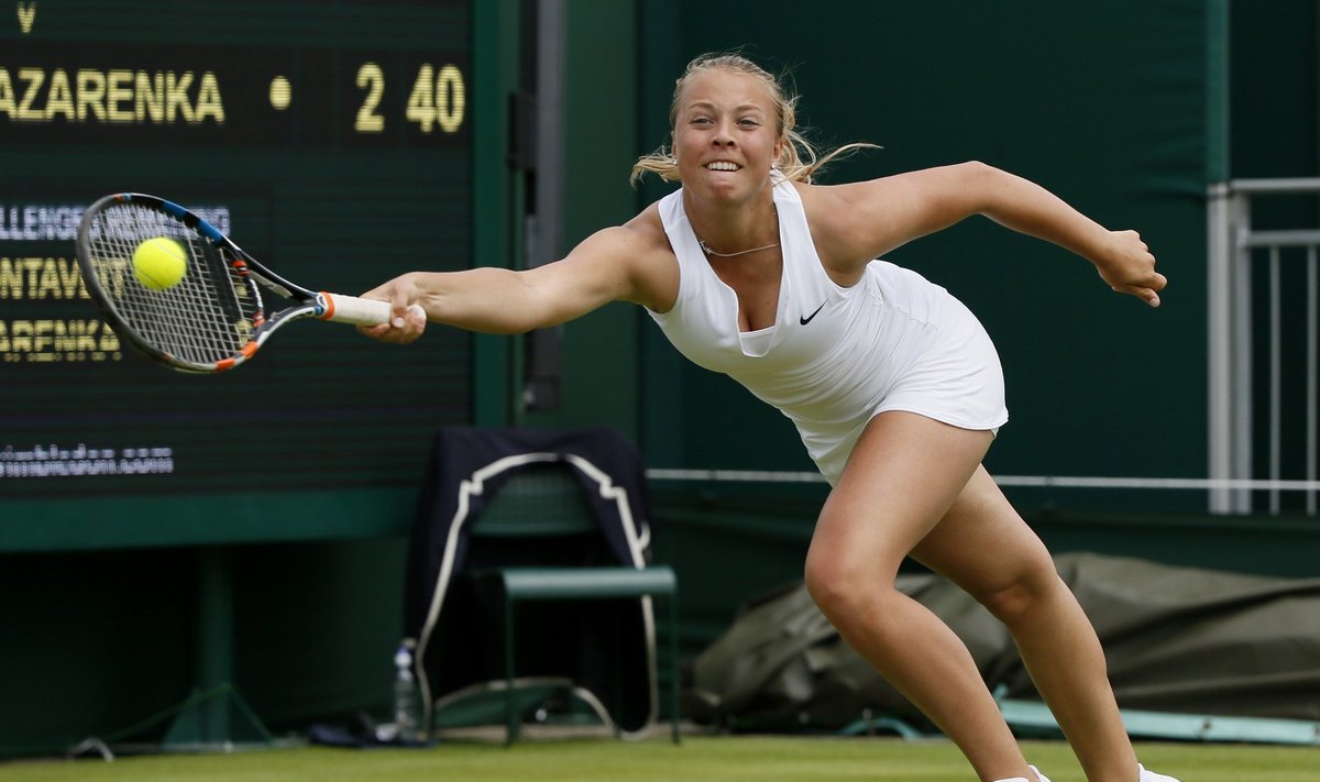 Anett Kontaveit of Estonia hits the ball during her match against Victoria Azarenka of Belarus. at the Wimbledon Tennis Championships in London