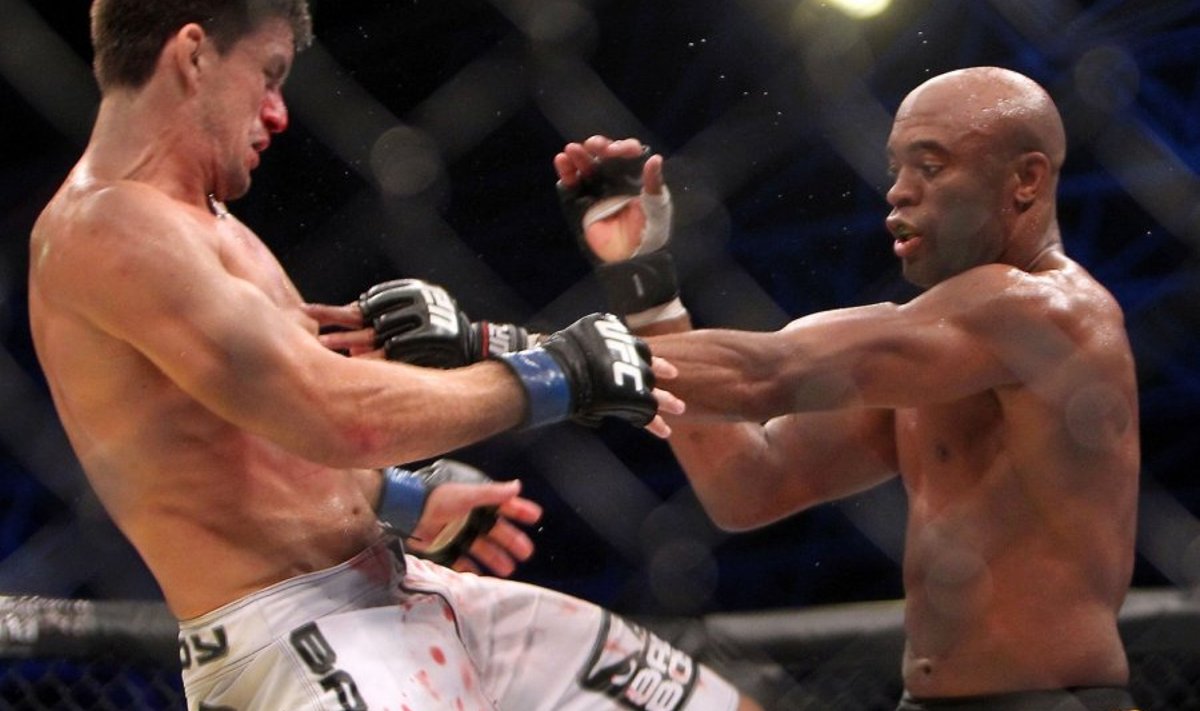 Brazil's Anderson Silva (R) battles his compatriot Demian Maia during their Ultimate Fighting Championship (UFC) 112 middleweight bout in Abu Dhabi on April 10, 2010. Silva won the fight. AFP PHOTO/KARIM SAHIB