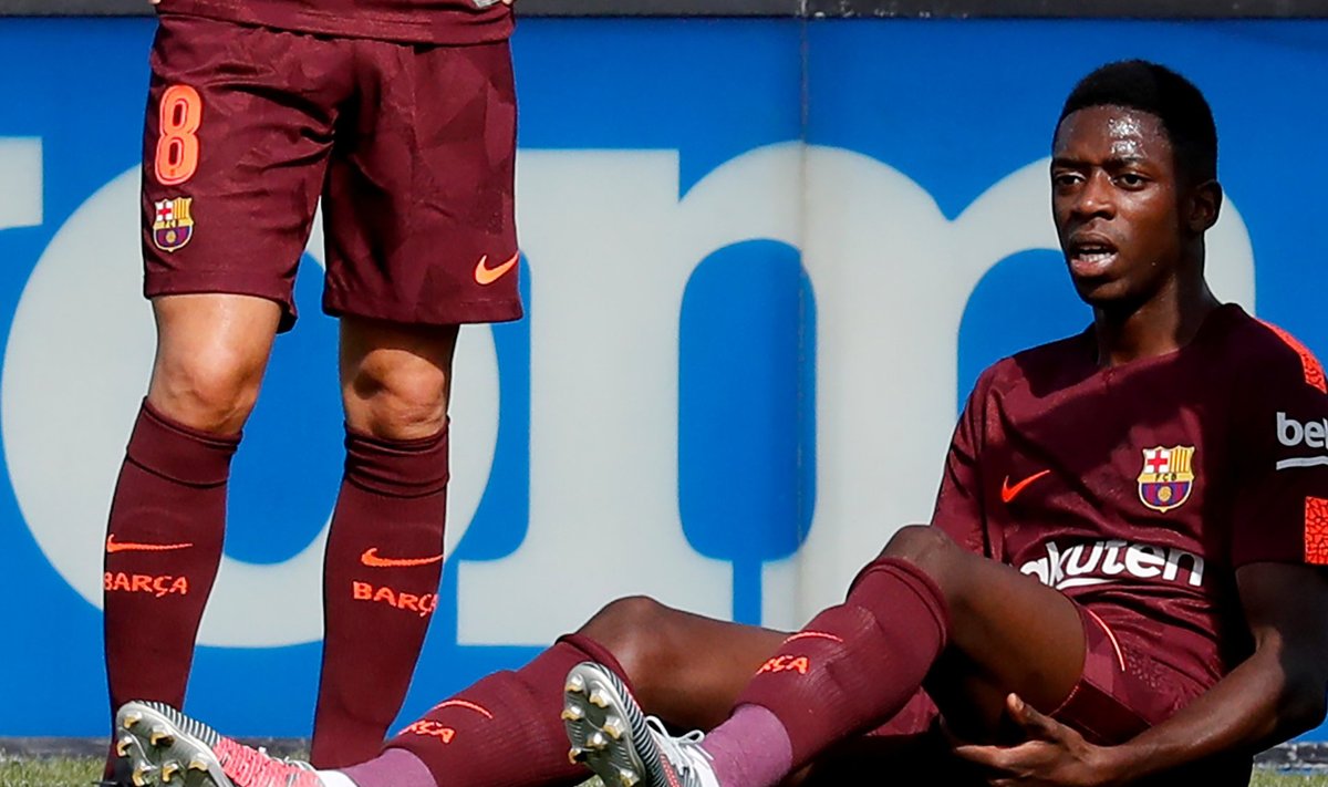 Barcelona's record signing Dembele reacts after sustaining an injured during his Spanish La Liga match against Getafe