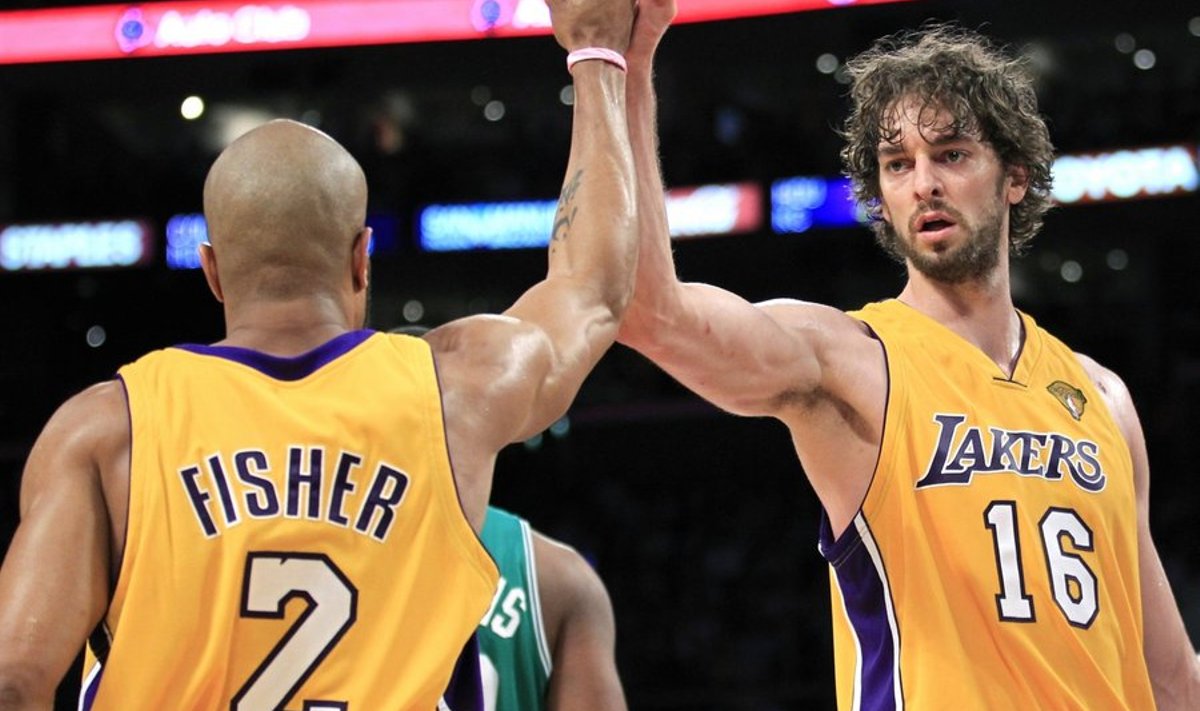 Los Angeles Lakers' Derek Fisher (L) and teammate Pau Gasol celebrate in the second quarter of their game against the Boston Celtics during Game 6 of the 2010 NBA Finals basketball series in Los Angeles, California, June 15, 2010 .     REUTERS/Mike Blake (UNITED STATES - Tags: SPORT BASKETBALL)