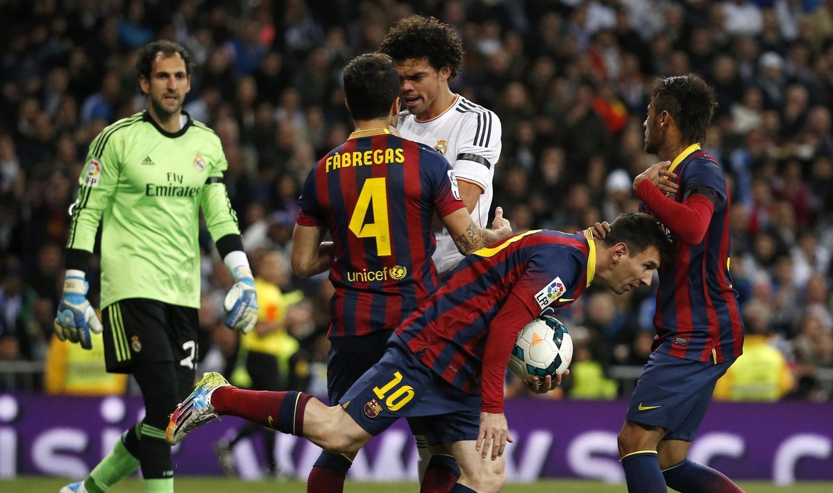Barcelona's Lionel Messi and Neymar celebrate a goal as Real Madrid's Pepe takes Cesc Fabregas by the neck during La Liga's second 'Clasico' soccer match of the season in Madrid