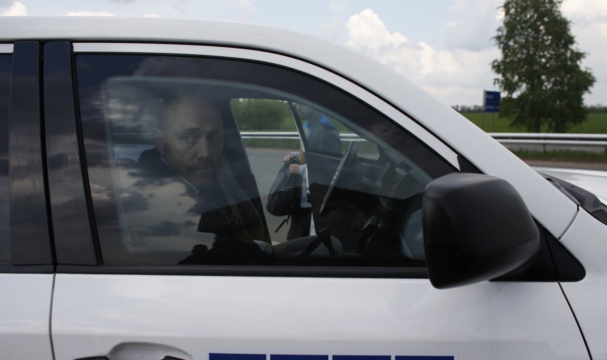 OSCE observer Axel Schneider sits in a car on a road 30 km (19 miles) from Donetsk after being freed by pro-Russian separatists
