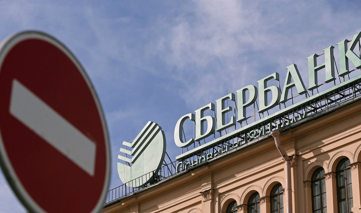 A traffic sign is on display in front of an office of Sberbank in St. Petersburg