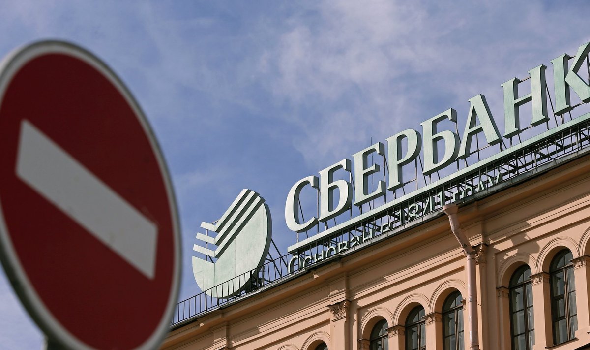 A traffic sign is on display in front of an office of Sberbank in St. Petersburg
