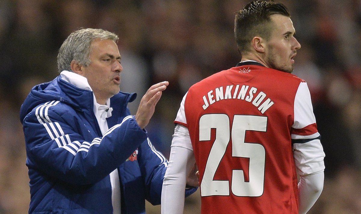 Chelsea's manager Mourinho reacts with Arsenal's Jenkinson during their English League Cup fourth round soccer match at Emirates Stadium in London