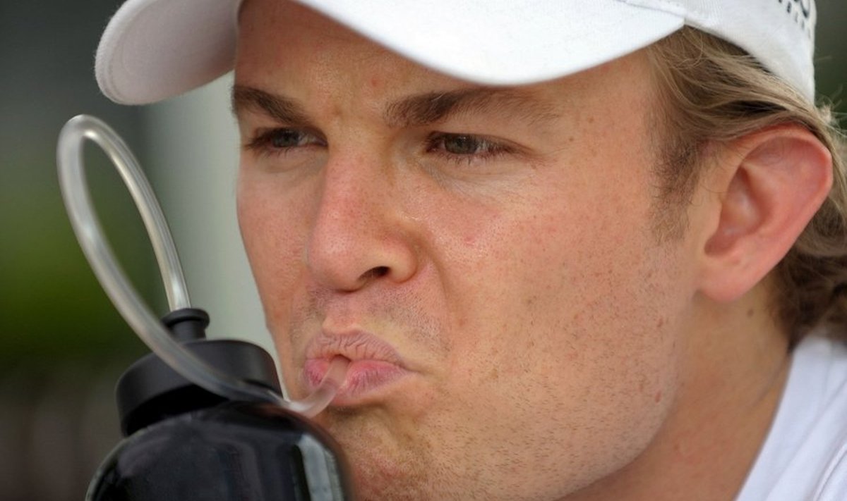 Mercedes driver Nico Rosberg of Germany drinks as he sits in the paddock area of Formula One's Malaysian Grand Prix in Sepang on April 1, 2010. The Malaysian Grand Prix will race over April 2 to 4.  AFP PHOTO/Christophe ARCHAMBAULT