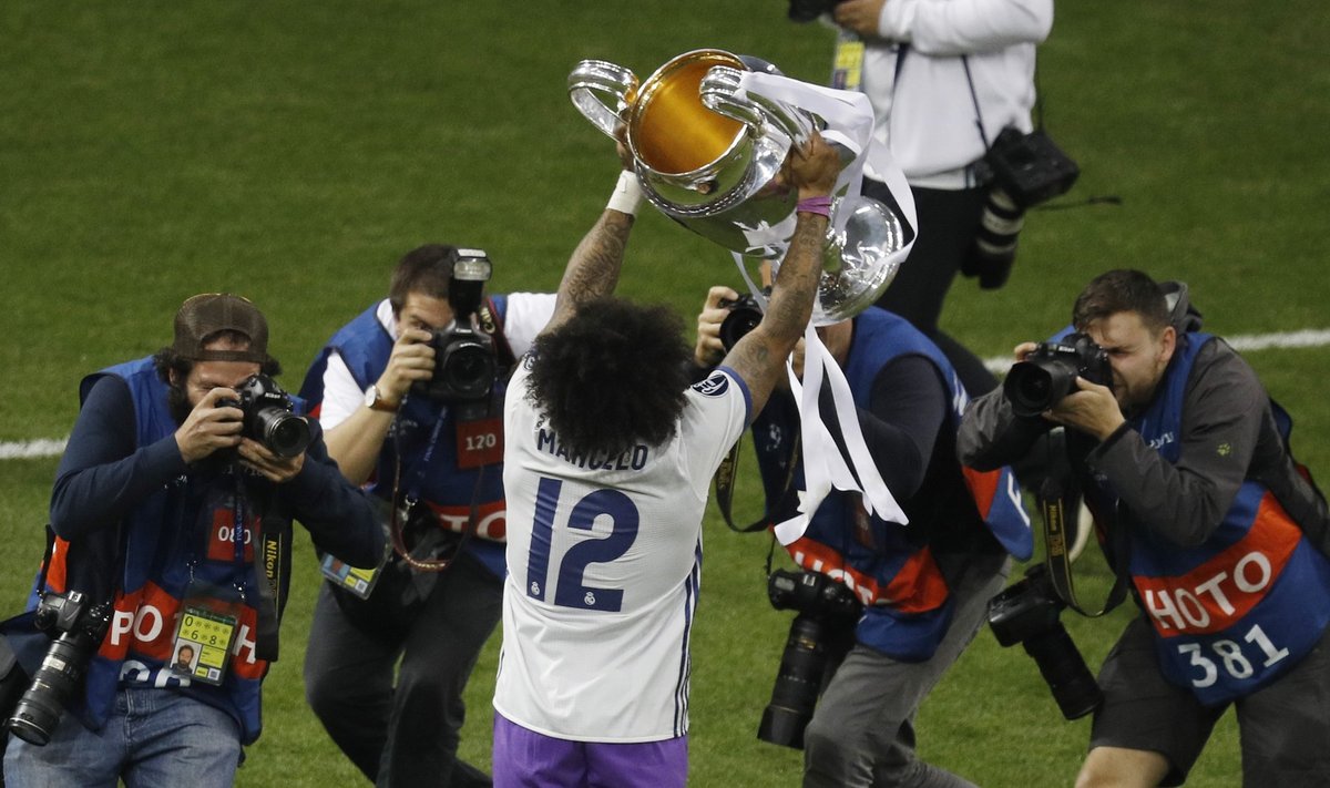 Real Madrid's Marcelo celebrates with the trophy after winning the UEFA Champions League Final