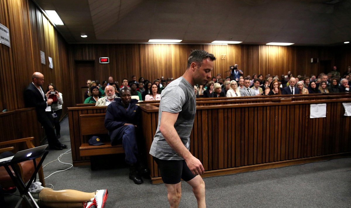 Paralympic gold medalist Oscar Pistorius walks across the courtroom without his prosthetic legs during the third day of the resentencing hearing for the 2013 murder of his girlfriend Reeva Steenkamp, at Pretoria High Court