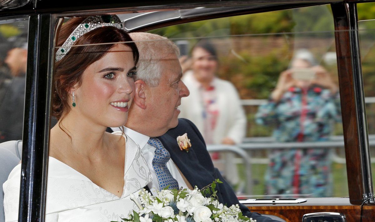 Princess Eugenie is driven towards St George's Chapel with her father Prince Andrew, Duke of York, for her wedding to Jack Brooksbank at Windsor Castle, Windsor