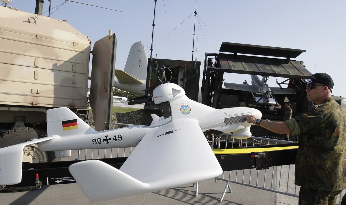 Soldier of German armed forces Bundeswehr puts final touch at LUNA drone system at ILA Berlin Air Show in Selchow