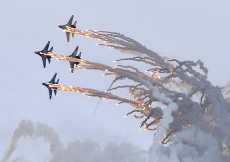 Sukhoi Su-27 jet fighters release flares as they perform during the "Russia Arms Expo 2013" 9th international exhibition of arms, military equipment and ammunition, in the Urals city of Nizhny Tagil