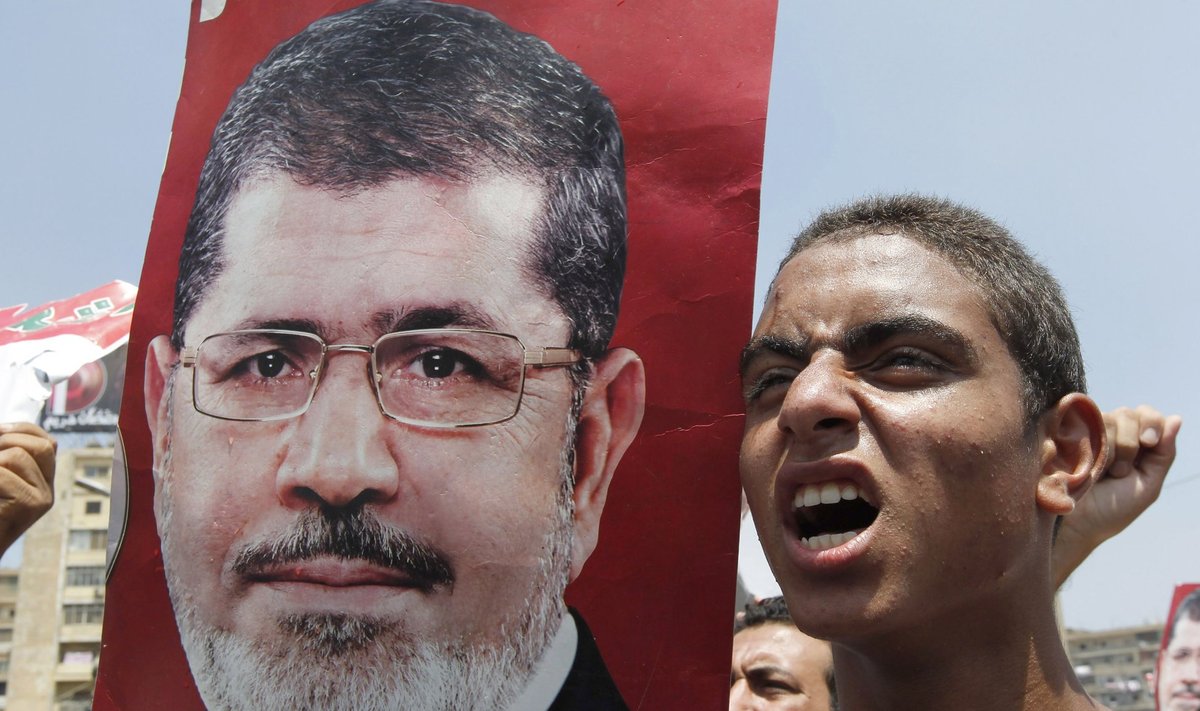 A member of the Muslim Brotherhood and supporter of ousted President Mohamed Mursi shouts slogans in Cairo
