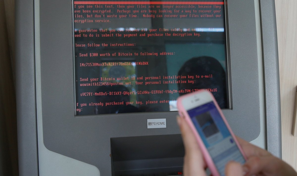 A message demanding money is seen on a monitor of a payment terminal at a branch of Ukraine's state-owned bank Oschadbank after Ukrainian institutions were hit by a wave of cyber attacks earlier in the day, in Kiev