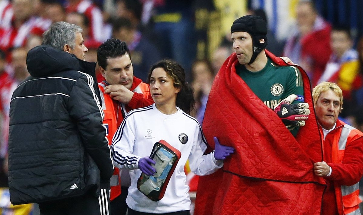 Chelsea's goal keeper Petr Cech is escorted off the pitch by the team doctor after being injured during their Champion's League semi-final first leg soccer match against Atletico Madrid at Vicente Calderon stadium in Madrid
