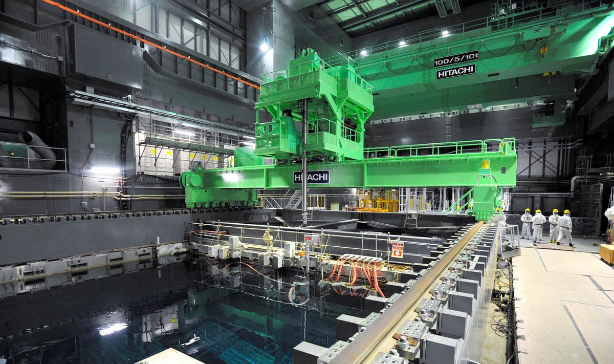 Kyodo file photo shows crane units installed over the spent fuel pool inside the No.4 reactor building at TEPCO's Fukushima Daiichi nuclear power plant