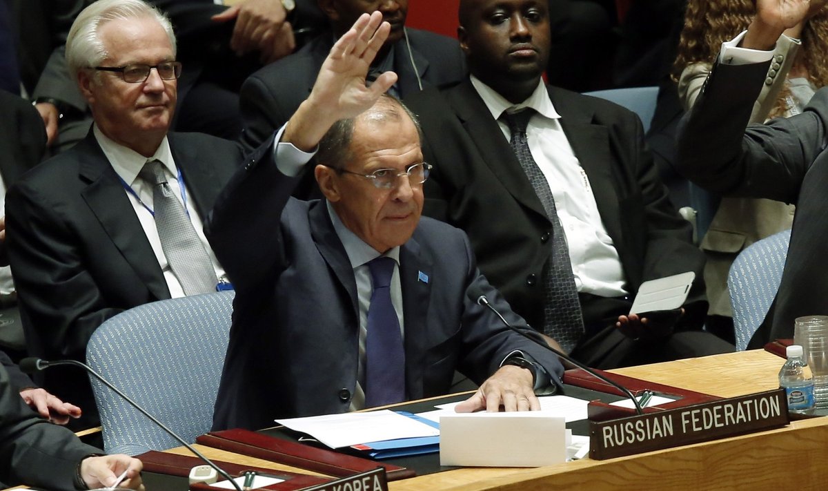Russian Foreign Minister Sergei Lavrov votes in favor of a resolution eradicating Syria's chemical arsenal during a Security Council meeting amid the 68th U.N. General Assembly in New York