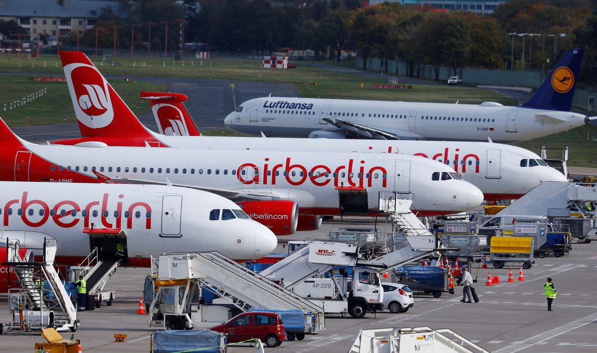 FILE PHOTO: A Lufthansa airliner taxis next to the Air Berlin aircraft at Tegel airport in Berlin