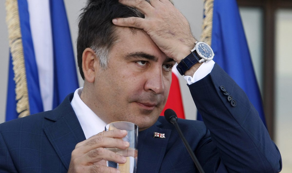 Georgia's President Saakashvili reacts during a joint news conference with NATO Secretary General Rasmussen in Tbilisi